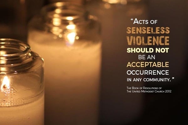 Candles with anti-violence quote from United Methodist Church.