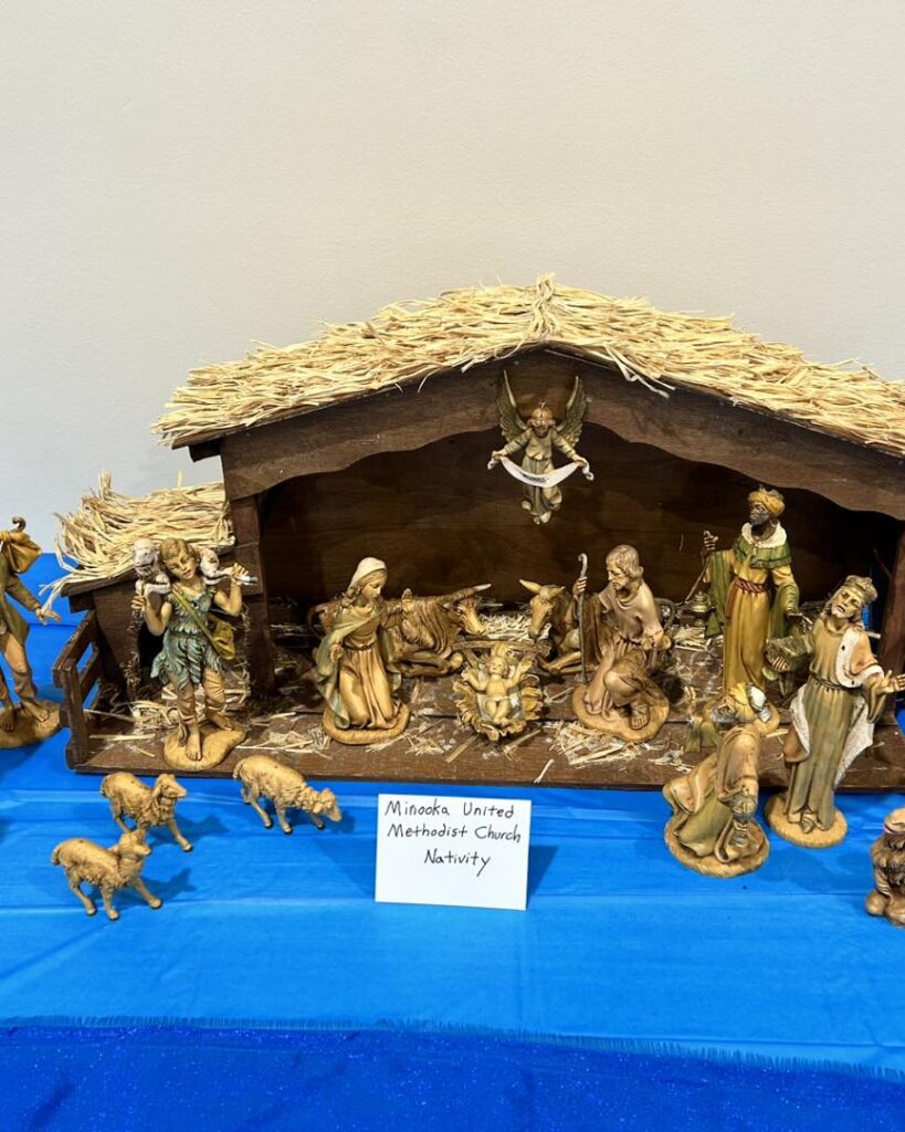 Nativity scene display with figures in stable.
