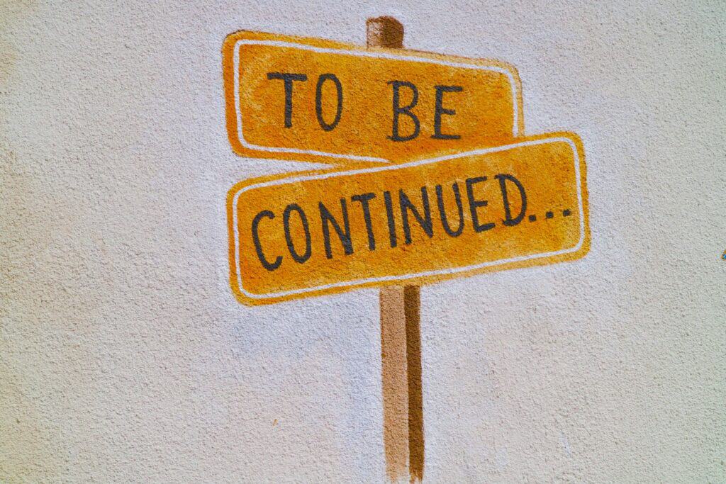 Yellow sign reading To Be Continued