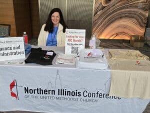 Woman at church conference merchandise booth display